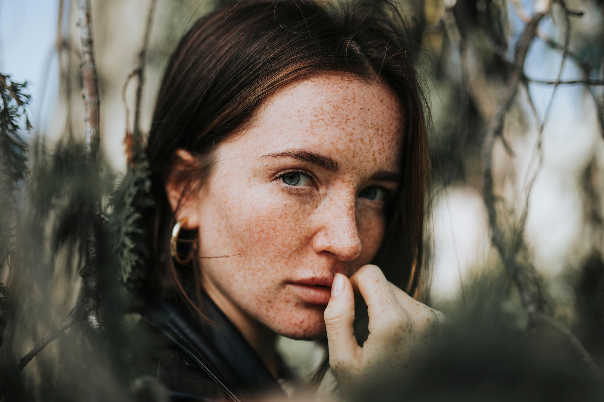 Portrait of a young woman with freckles